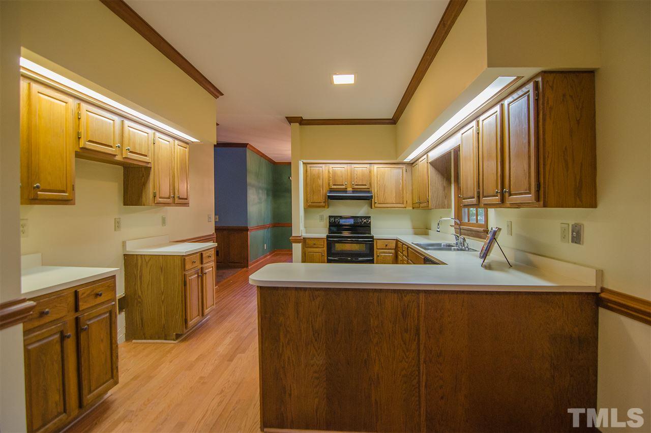 1301 Cool Spring Road Raleigh, NC 27614 - Photo 10 of 25 The peninsula gives added counter space while giving an open feel separation from the breakfast room.
