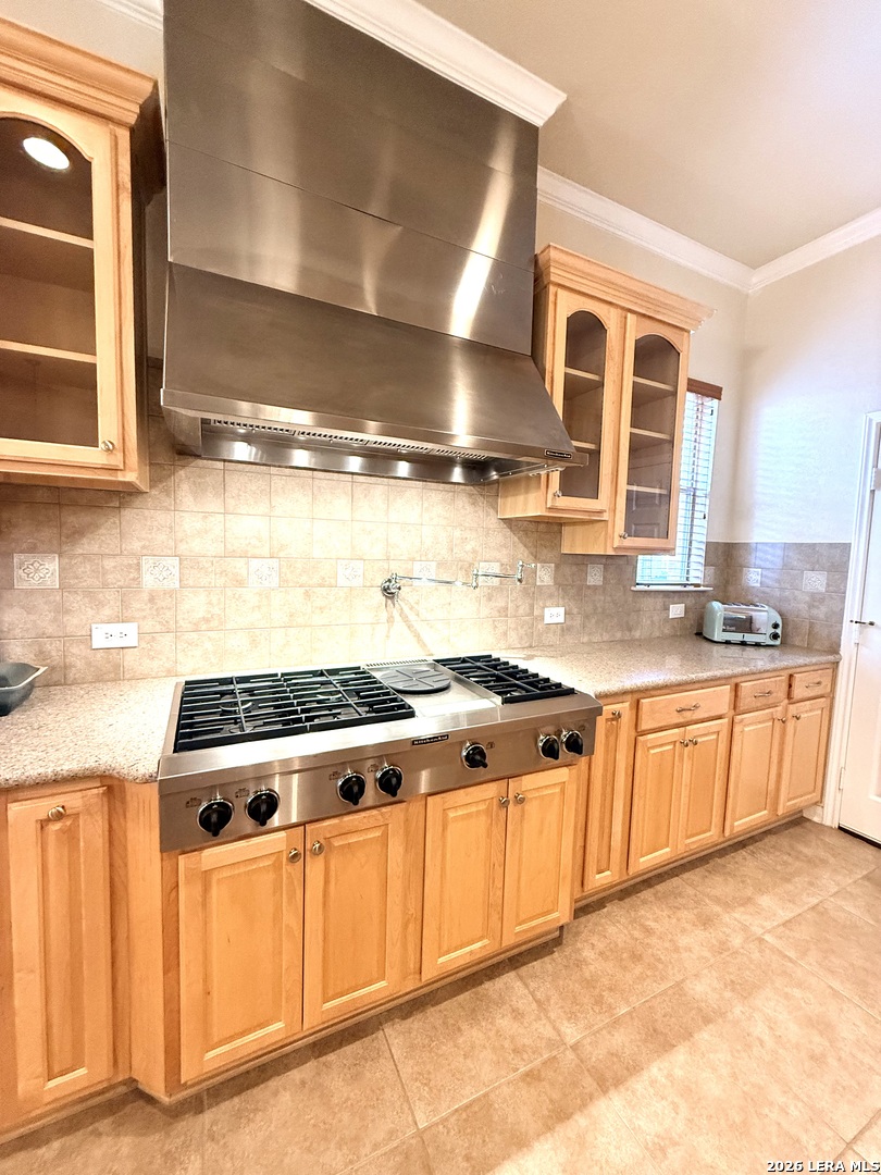 101 Rattlesnake Bluff Boerne, TX 78006 - Photo 15 of 28 a kitchen with stainless steel appliances granite countertop a stove a sink and a granite counter tops