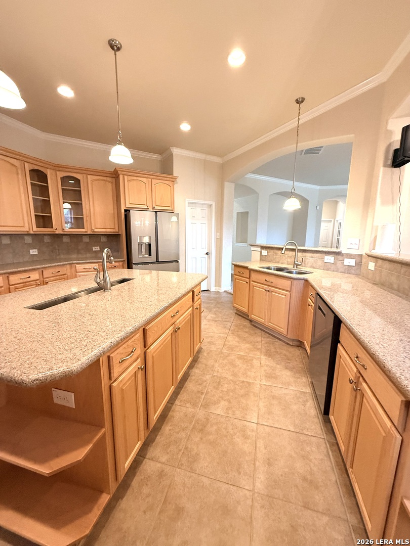 101 Rattlesnake Bluff Boerne, TX 78006 - Photo 17 of 28 a large kitchen with kitchen island a large counter space appliances and a sink
