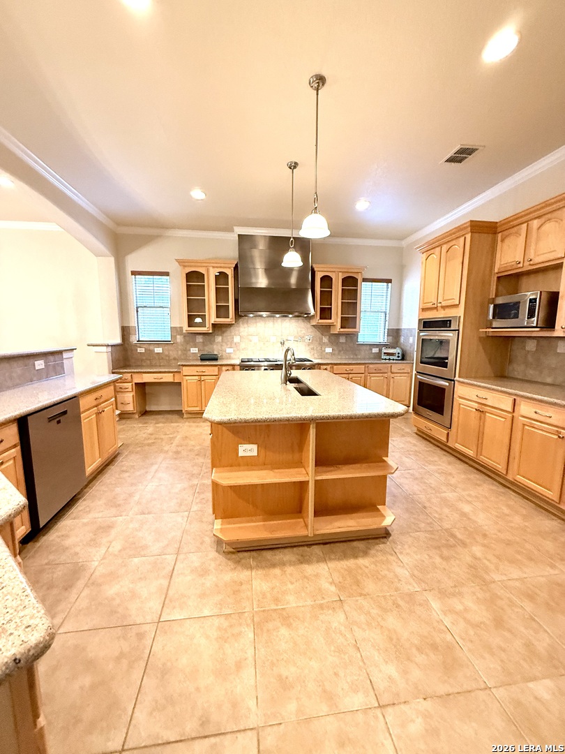 101 Rattlesnake Bluff Boerne, TX 78006 - Photo 18 of 28 a large kitchen with kitchen island a large counter top and appliances