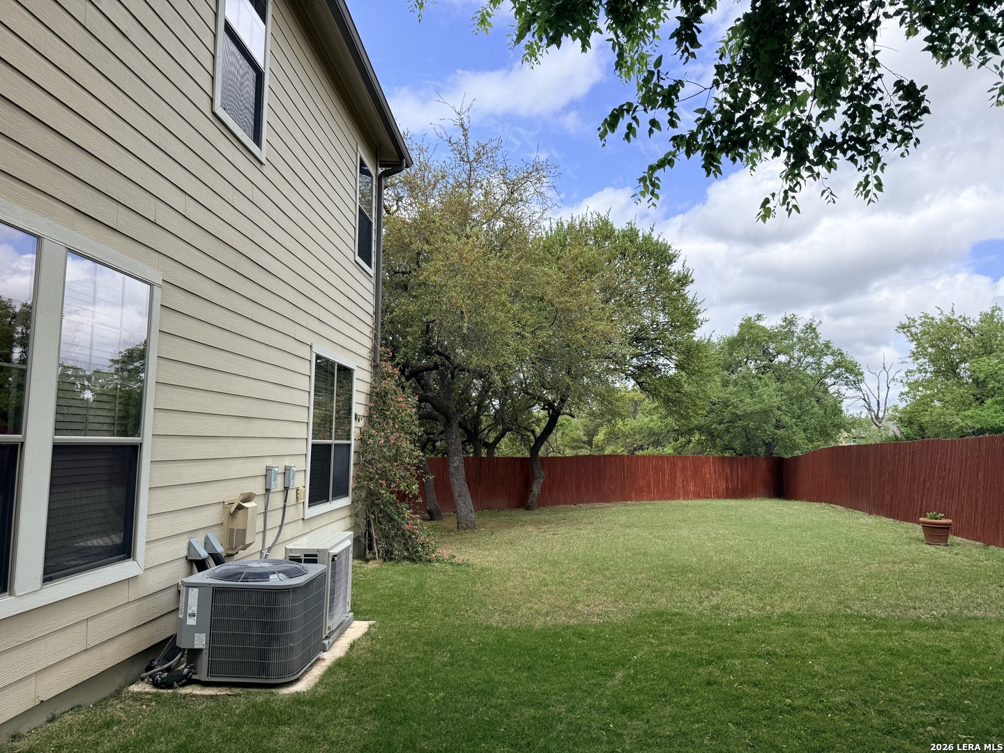 101 Rattlesnake Bluff Boerne, TX 78006 - Photo 20 of 28 a view of backyard with outdoor seating and green space