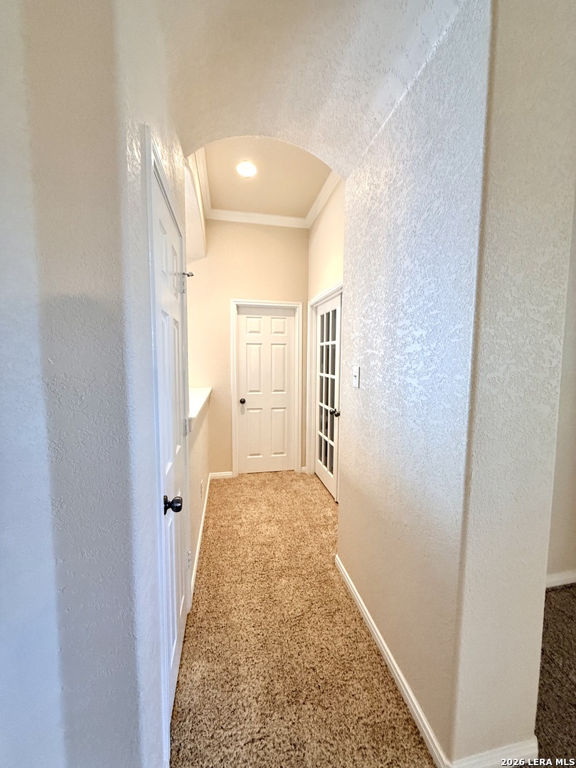 101 Rattlesnake Bluff Boerne, TX 78006 - Photo 7 of 28 a view of a hallway with wooden floor and a bathroom