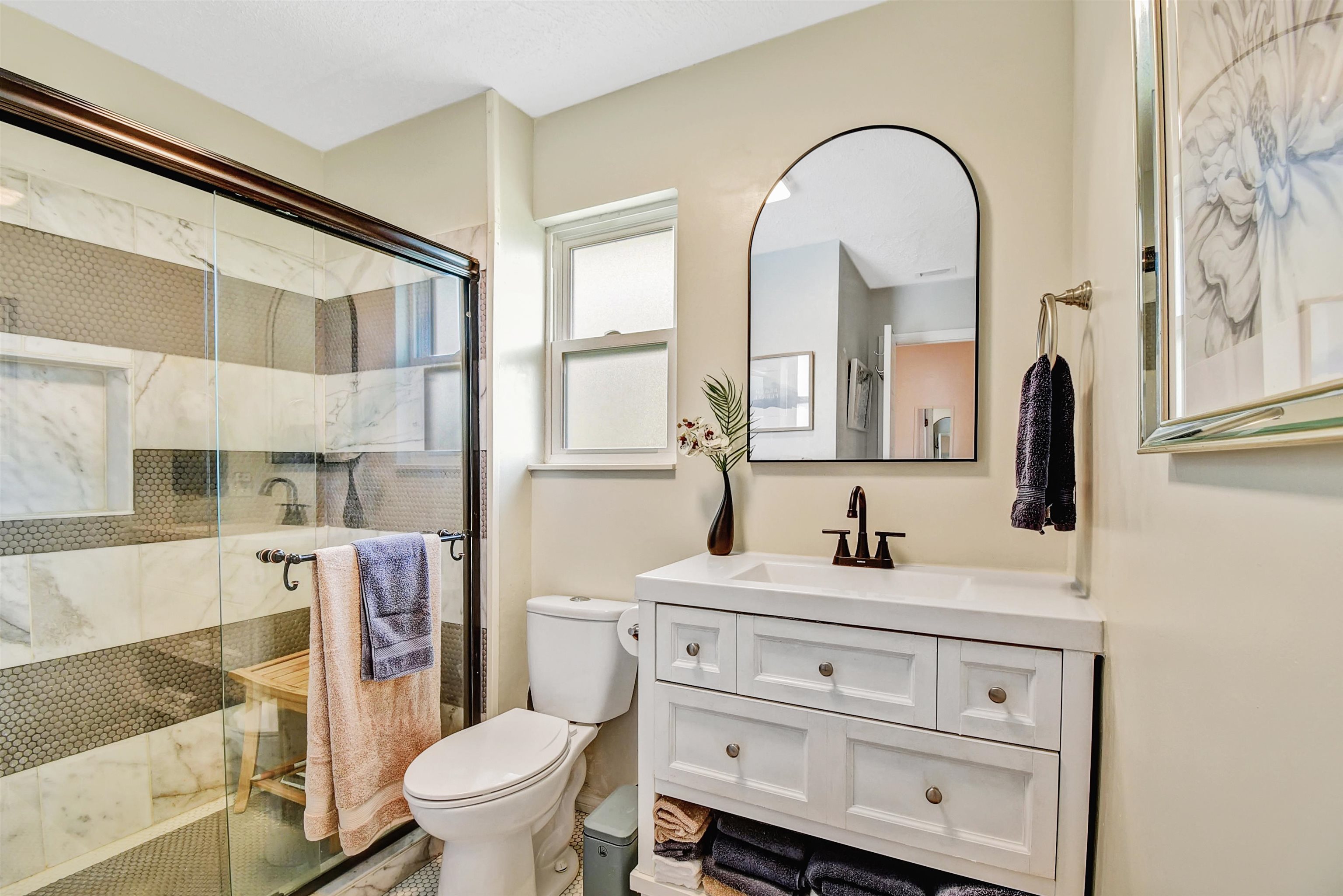 5703 Rudolph Avenue St. Augustine, FL 32080 - Photo 11 of 29 a bathroom with a toilet sink and mirror