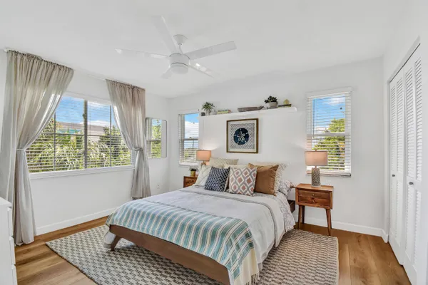 a bedroom with a large bed and a window