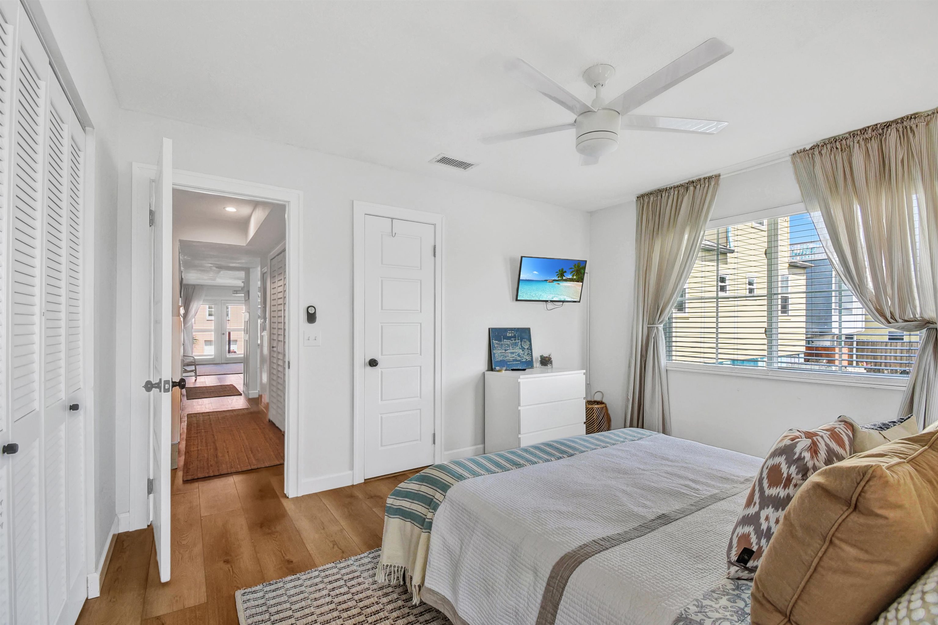 5703 Rudolph Avenue St. Augustine, FL 32080 - Photo 13 of 29 a bedroom with a bed and wooden floor