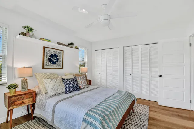 a bedroom with bed and cupboard