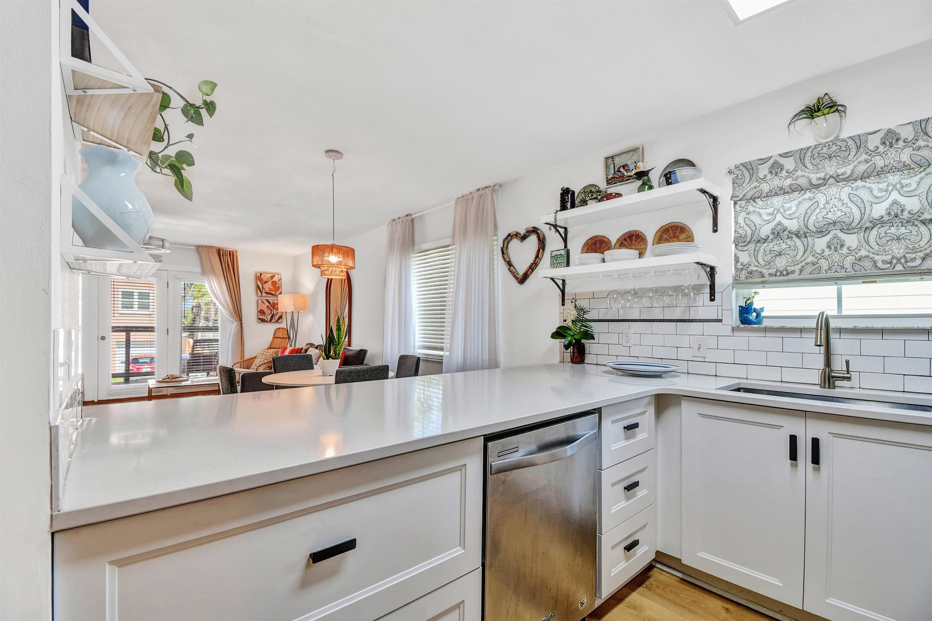 5703 Rudolph Avenue St. Augustine, FL 32080 - Photo 9 of 29 a kitchen with stainless steel appliances a sink and a window