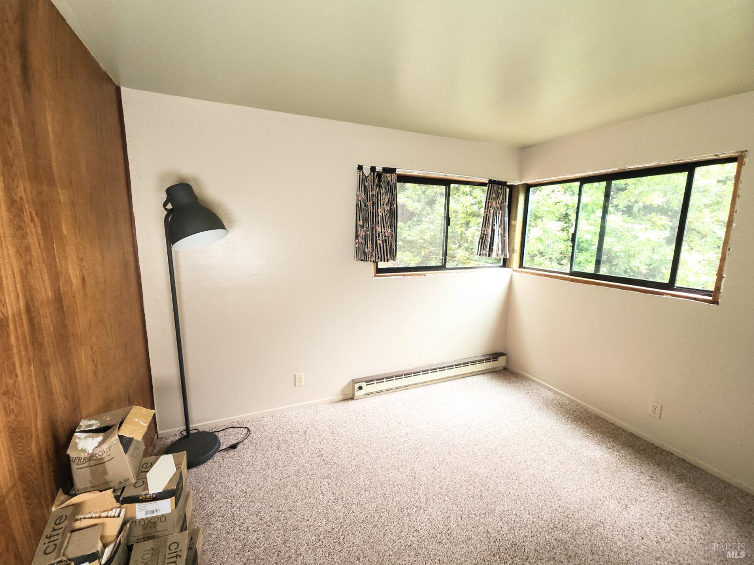 15551 Forest View Road Manchester, CA 95459 - Photo 11 of 53 a view of an empty room with a window