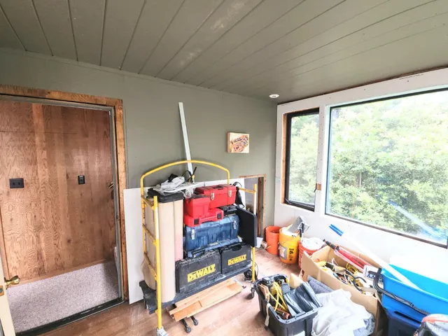 a bedroom with furniture and a window