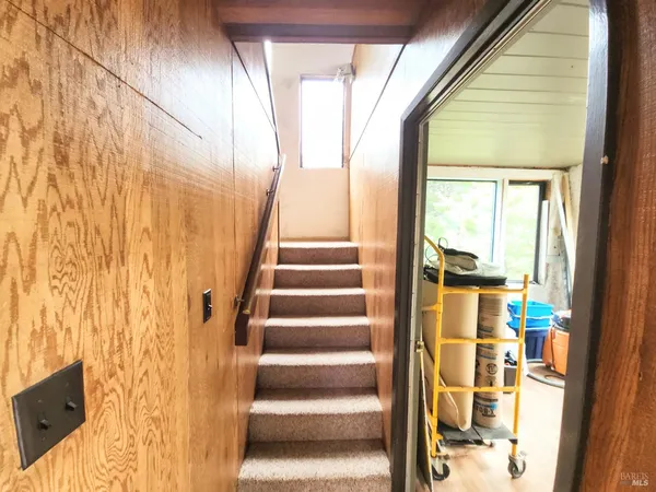 a view of entryway with wooden floor and door