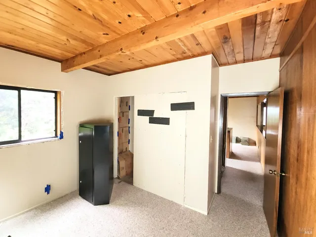 a view of a hallway with washer and dryer