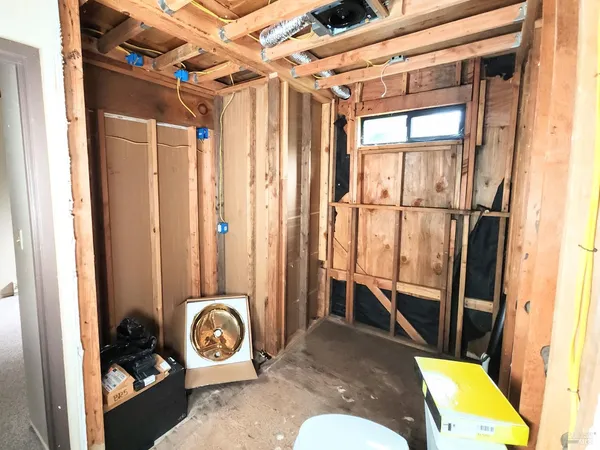 a bathroom with a toilet and shower