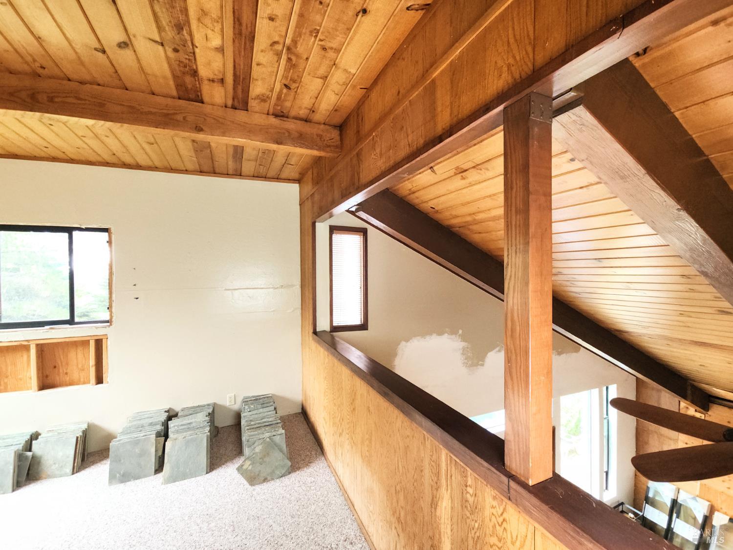 15551 Forest View Road Manchester, CA 95459 - Photo 35 of 53 a view of a balcony with furniture and wooden floor