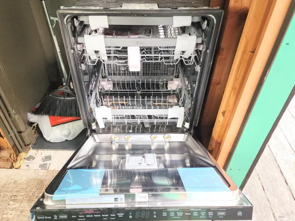 a view of a backyard with wooden fence