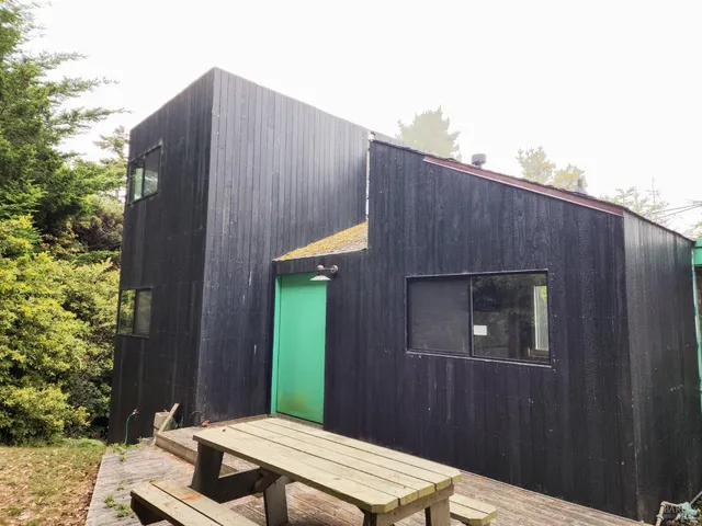 a view of a house with a small yard and plants