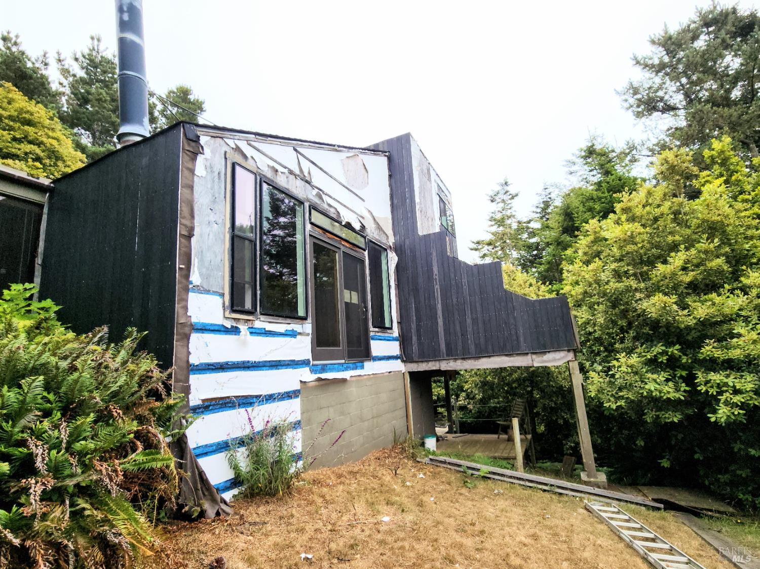 15551 Forest View Road Manchester, CA 95459 - Photo 44 of 53 a view of a house with a small yard and plants