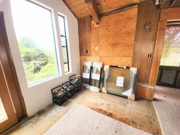 a view of a livingroom with furniture and windows