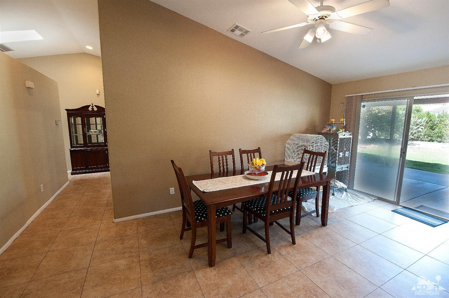 68874 Risueno Road Cathedral City, CA 92234 - Photo 7 of 8 a view of a dining room with furniture