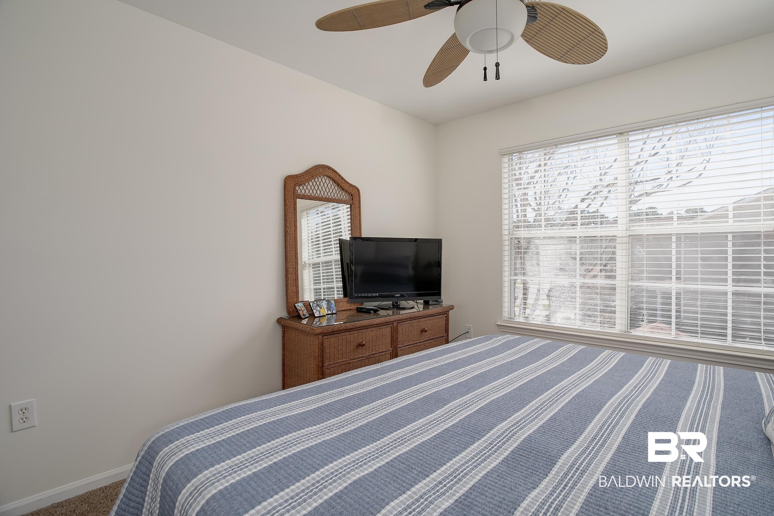 1517 Regency Road, Unit 33 Gulf Shores, AL 36542 - Photo 15 of 29 Bedroom with ceiling fan and baseboards