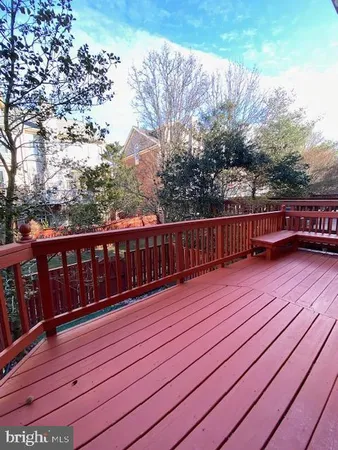 a view of deck with wooden floor and fence