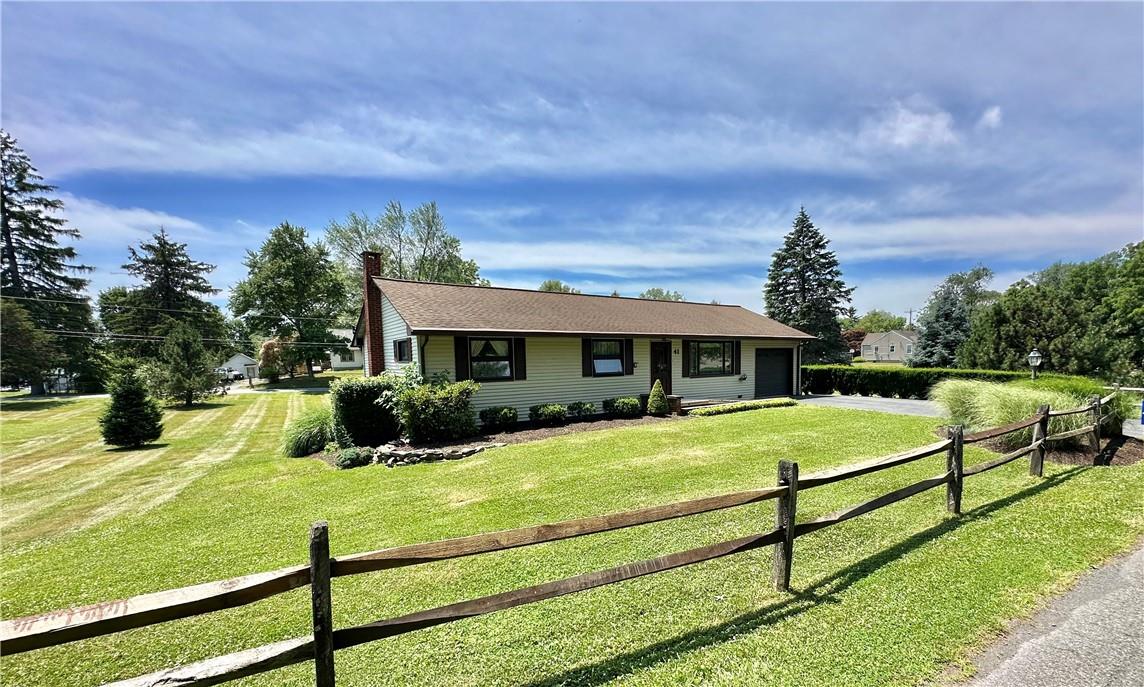 Ranch-style house with a front lawn