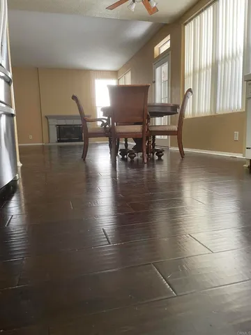 a view of a chair and tables in the patio