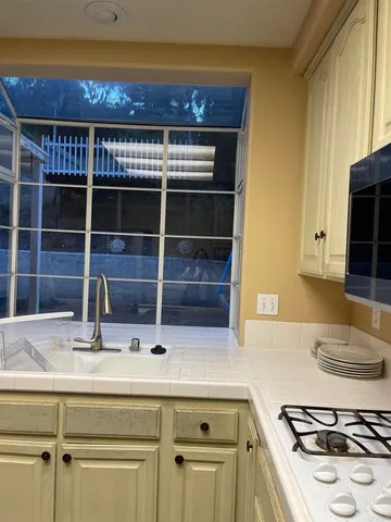 a work room with furniture and wooden floor