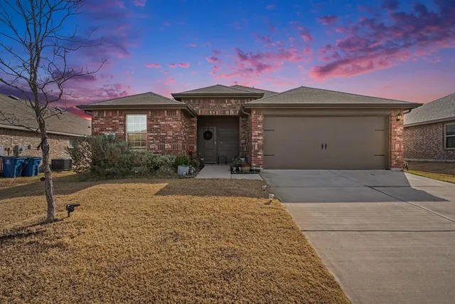 a living room with furniture a rug and a flat screen tv