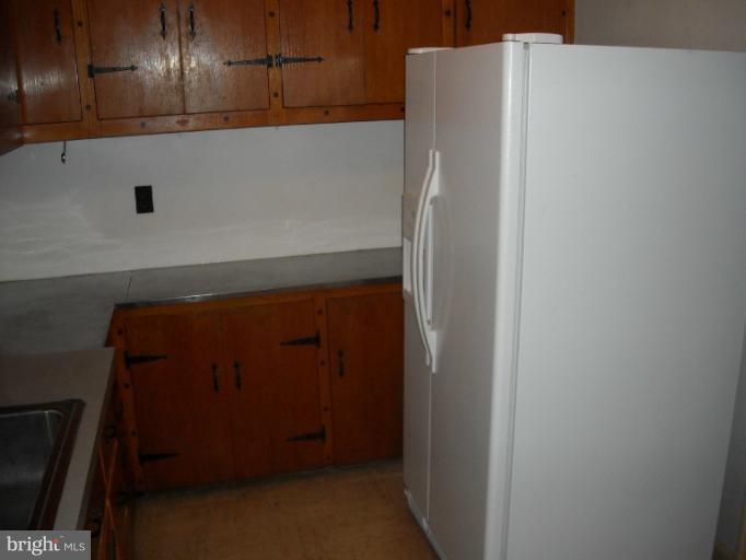 1501 Shawan Road Cockeysville, MD 21030 - Photo 14 of 24 a white refrigerator freezer sitting inside of a kitchen