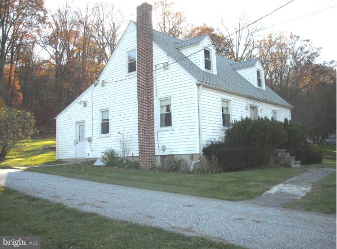 1501 Shawan Road Cockeysville, MD 21030 - Photo 7 of 24 a view of a house with backyard and trees