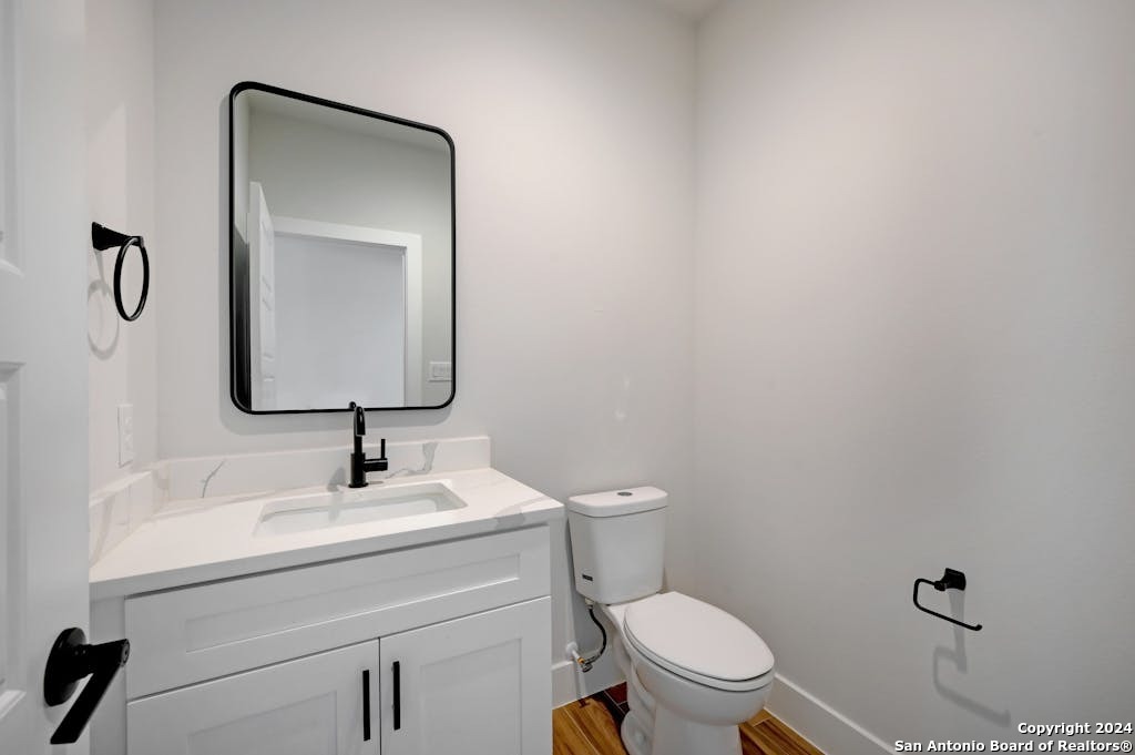 102 George Erath Blanco, TX 78606 - Photo 15 of 20 a bathroom with a toilet sink and mirror