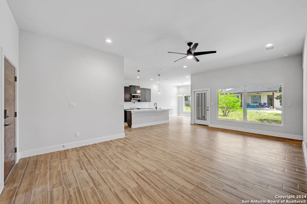 102 George Erath Blanco, TX 78606 - Photo 5 of 20 a view of kitchen with sink and wooden floor