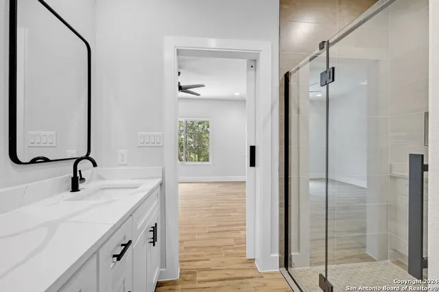 a bathroom with a sink and a mirror