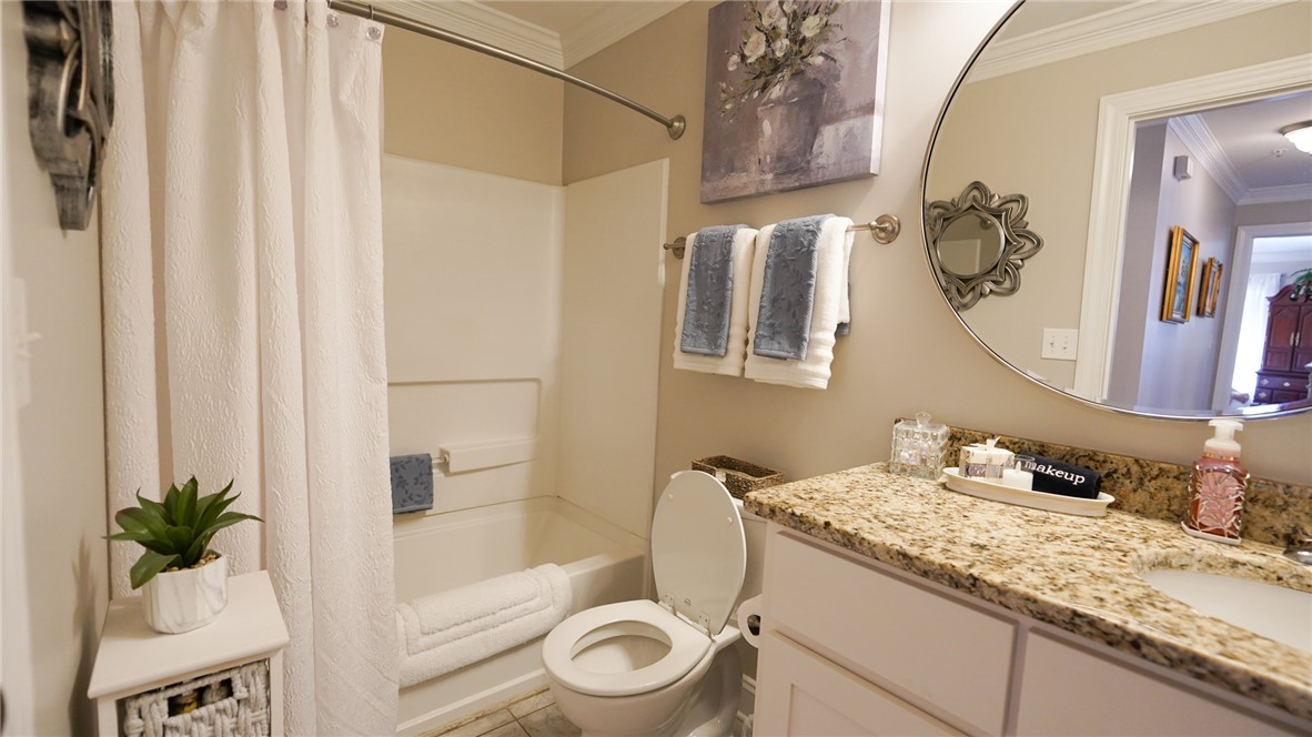 303 Lookover Drive Anderson, SC 29621 - Photo 20 of 46 This bathroom features a sleek vanity, convenient toilet, and a combined shower-bathtub for optimal utility.
