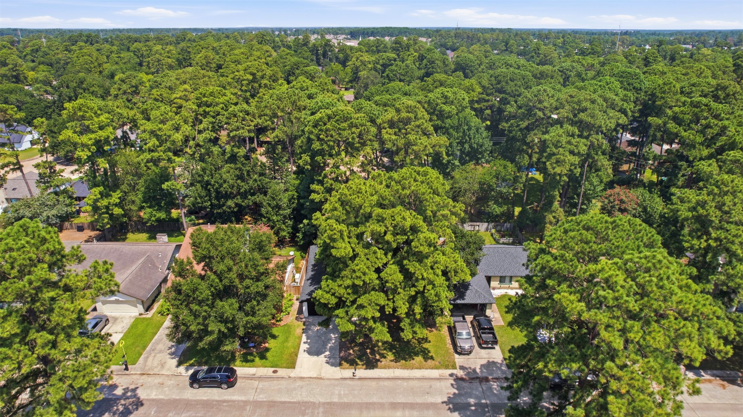 9518 Landry Boulevard Spring, TX 77379 - Photo 31 of 38 Nestled in a lush, tree-lined neighborhood, this property offers privacy and a serene atmosphere, with ample greenery and spacious lots.