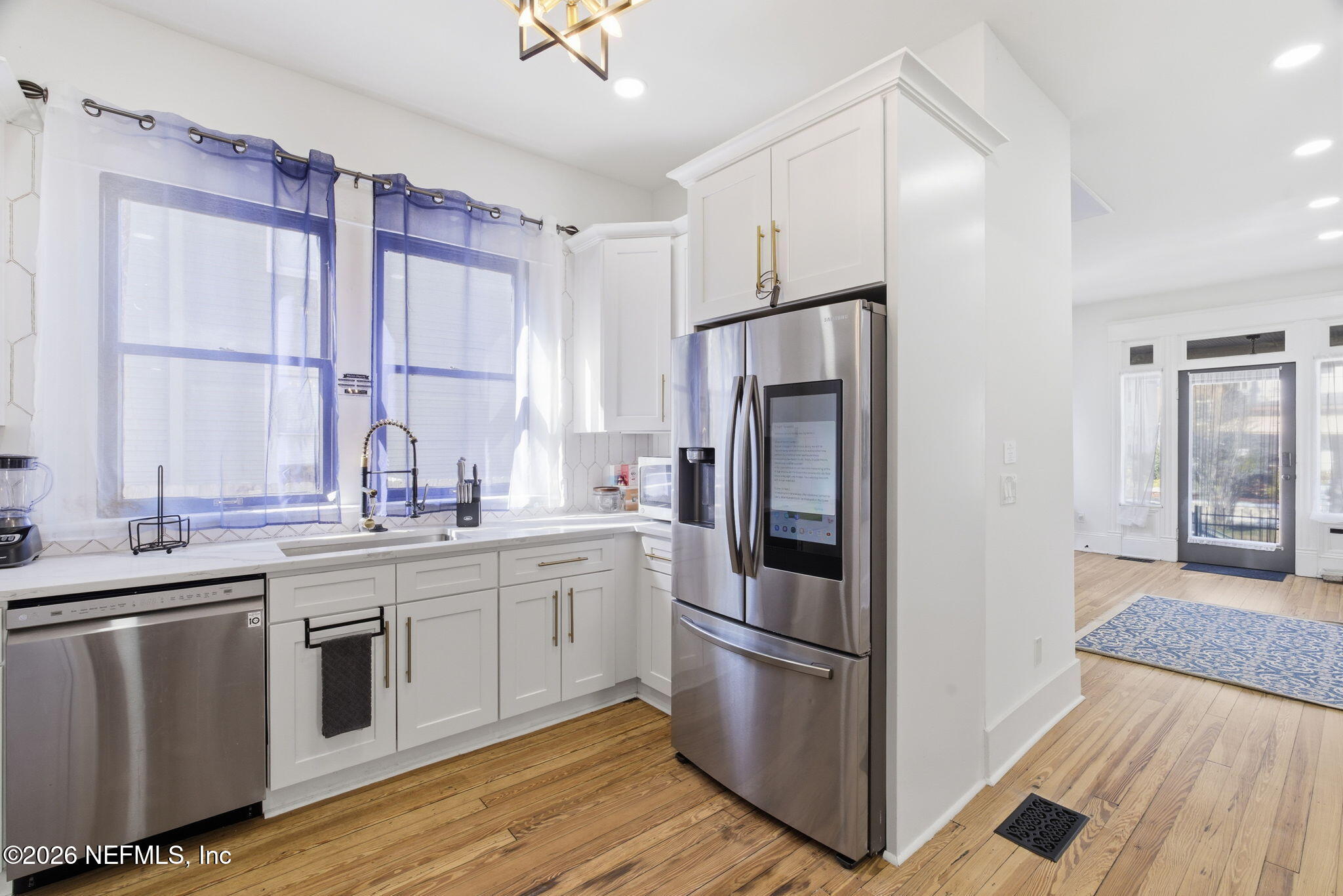 422 7th Street West Jacksonville, FL 32206 - Photo 18 of 71 a kitchen with stainless steel appliances a refrigerator sink and cabinets