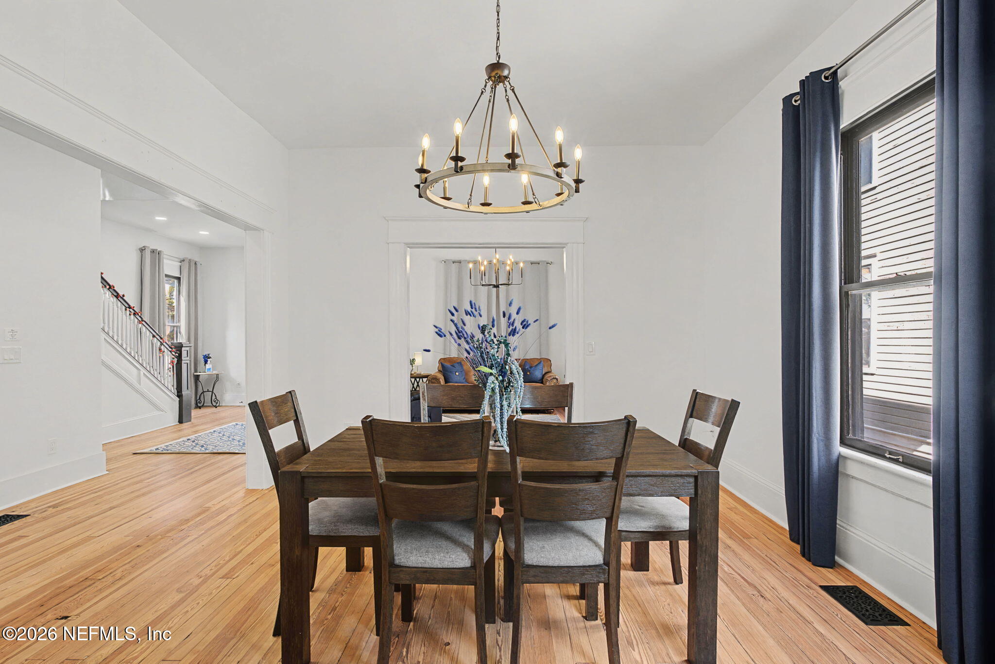 422 7th Street West Jacksonville, FL 32206 - Photo 19 of 71 a view of a dining room with furniture a chandelier and wooden floor