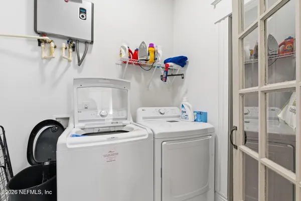 an aerial view of multiple houses with a yard