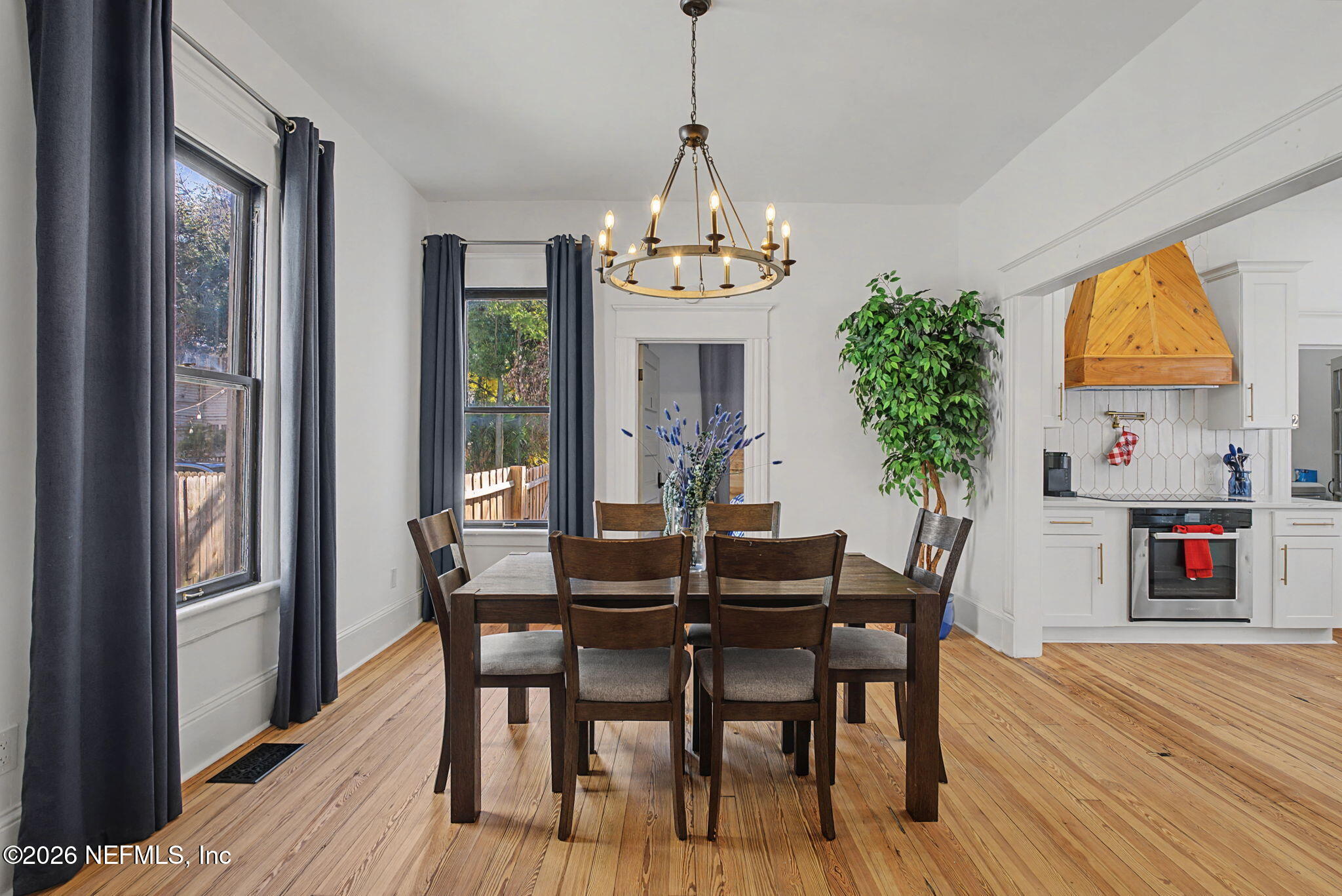 422 7th Street West Jacksonville, FL 32206 - Photo 25 of 71 a view of a dining room with furniture window and wooden floor