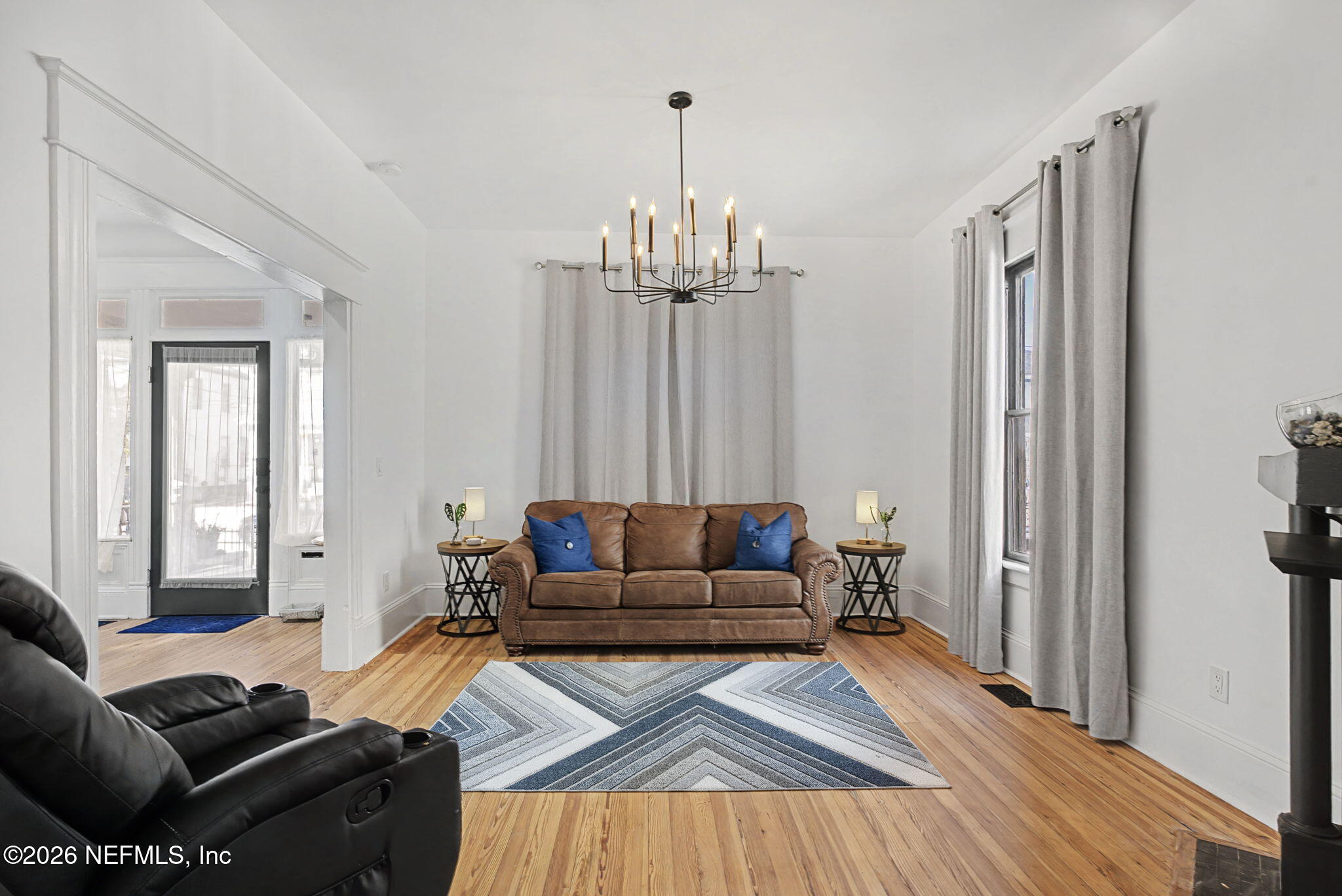 422 7th Street West Jacksonville, FL 32206 - Photo 31 of 71 a living room with furniture or couch and a chandelier