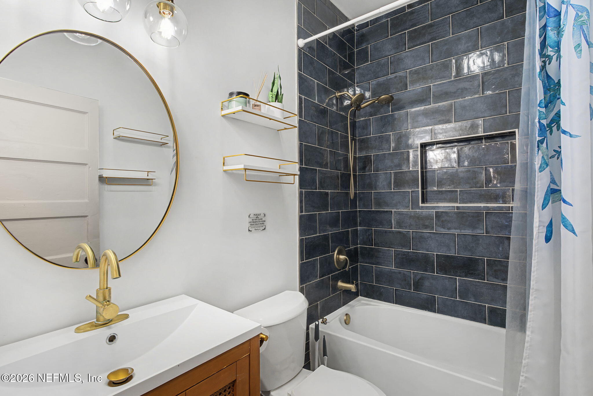 422 7th Street West Jacksonville, FL 32206 - Photo 35 of 71 a bathroom with a sink a toilet and shower