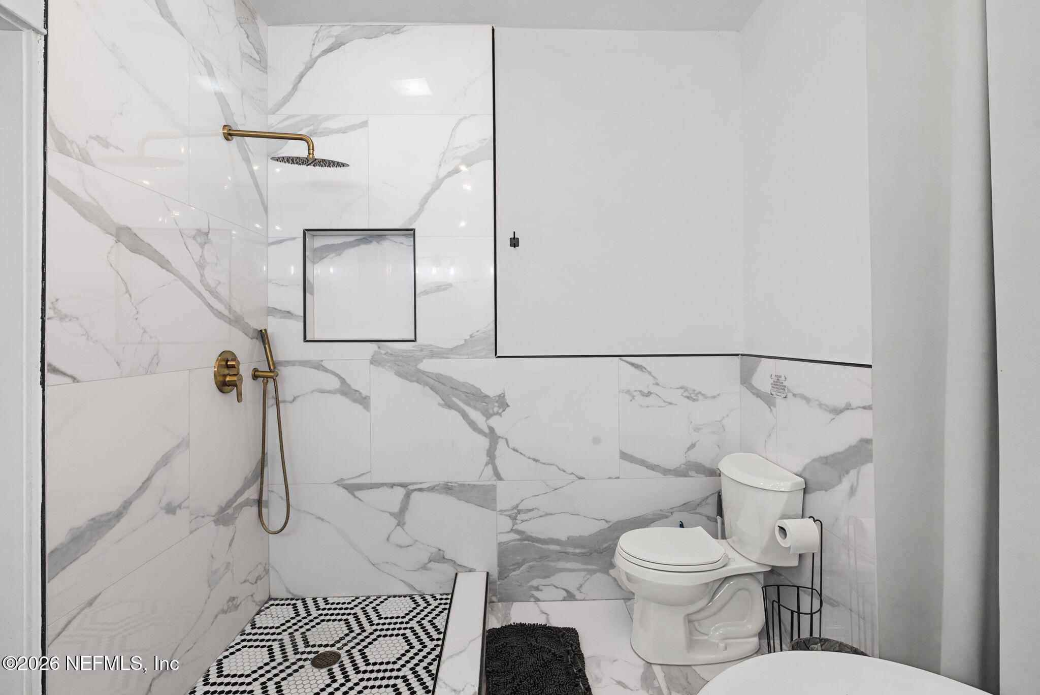 422 7th Street West Jacksonville, FL 32206 - Photo 37 of 71 a bathroom with a toilet and a shower