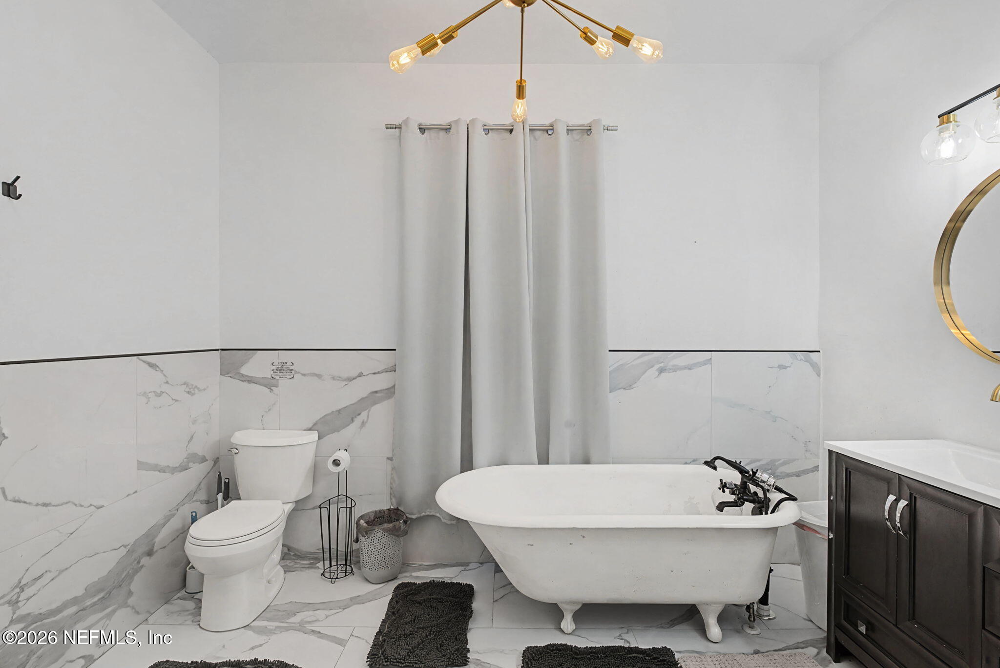 422 7th Street West Jacksonville, FL 32206 - Photo 38 of 71 a bathroom with a sink a toilet a mirror and shower