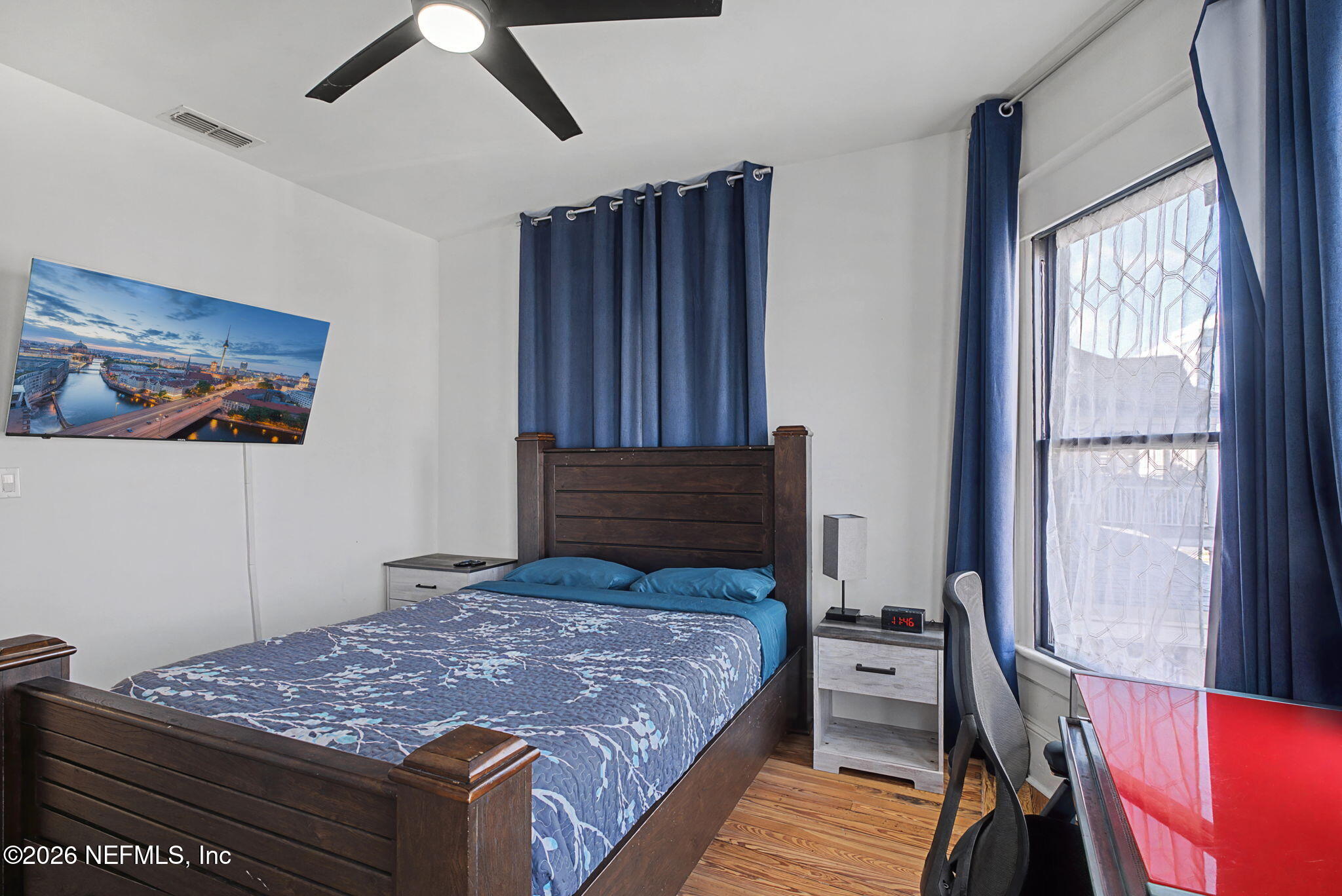 422 7th Street West Jacksonville, FL 32206 - Photo 38 of 71 a bedroom with a bed and wooden floor