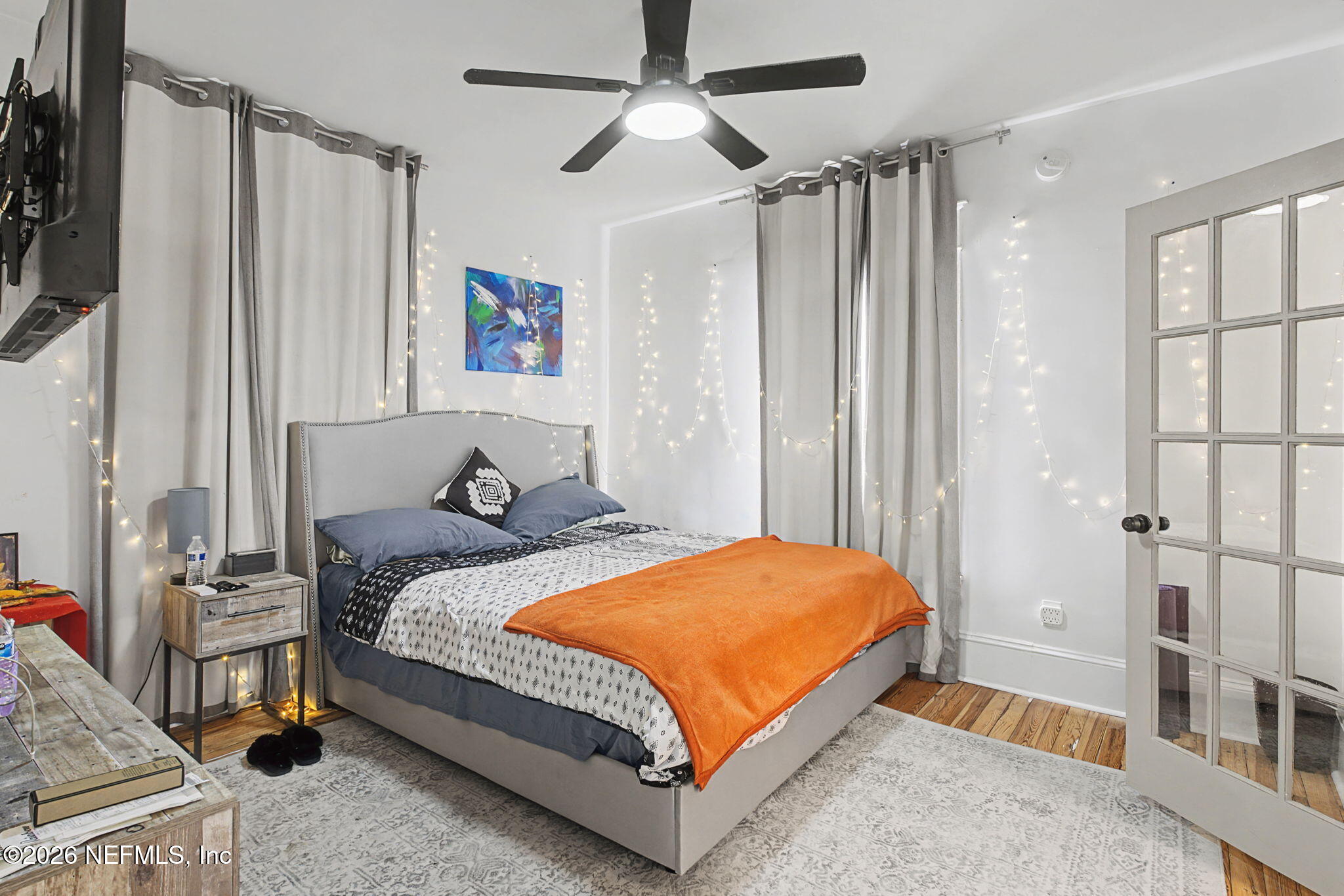 422 7th Street West Jacksonville, FL 32206 - Photo 43 of 71 a bedroom with a bed and a flat tv screen