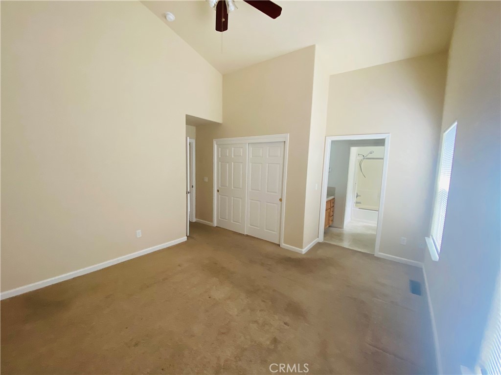 16506 Ridgecrest Court Hidden Valley Lake, CA 95467 - Photo 10 of 25 an empty room with closet and windows