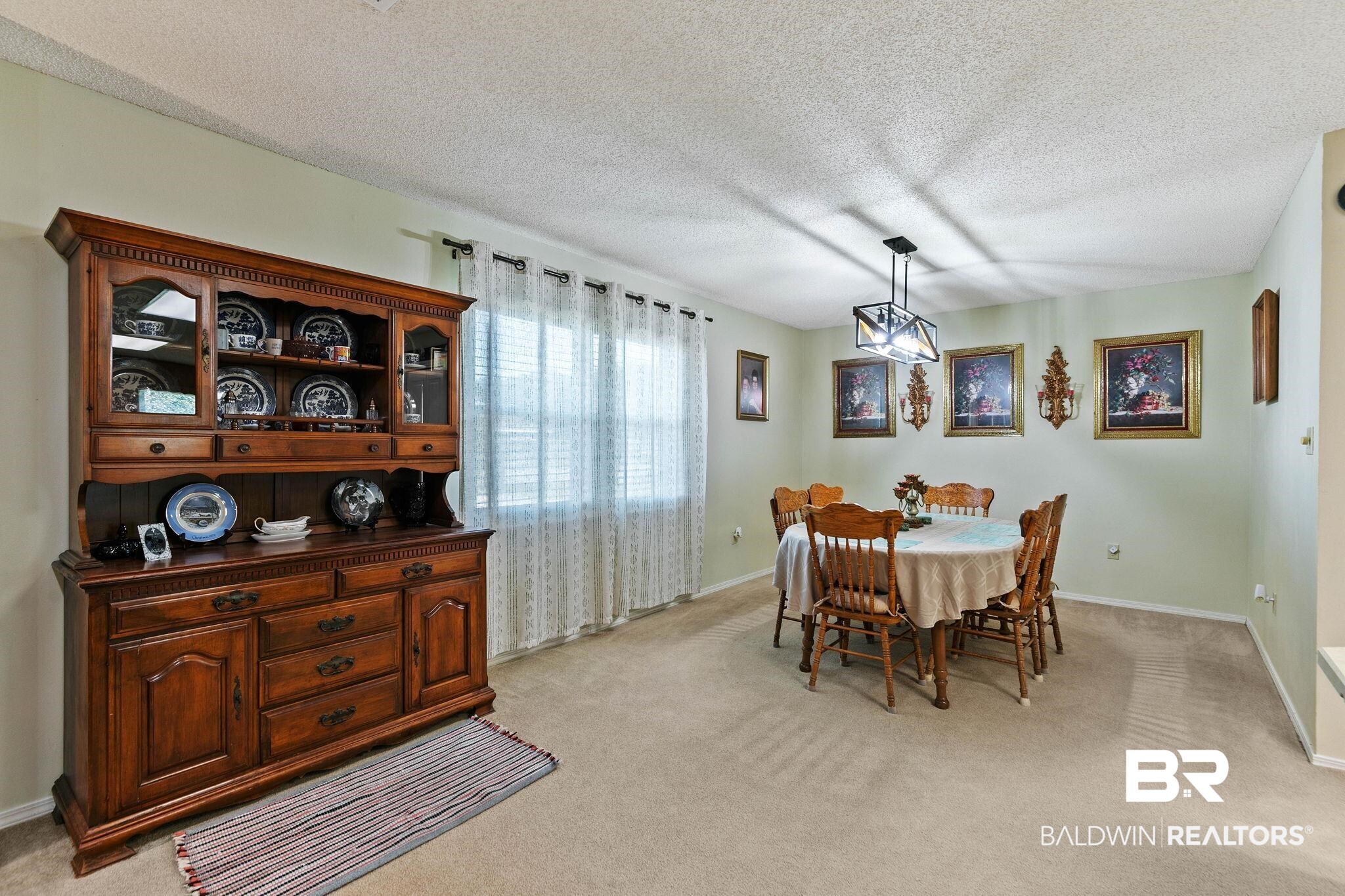 1510 South Juniper Street Foley, AL 36535 - Photo 10 of 36 Dining area featuring a textured ceiling and light carpet