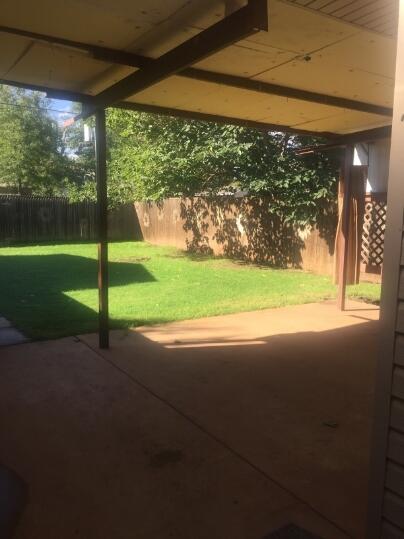3407 29th Street Lubbock, TX 79410 - Photo 14 of 21 a view of a yard with porch
