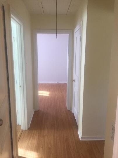 3407 29th Street Lubbock, TX 79410 - Photo 7 of 21 a view of a hallway with wooden floor