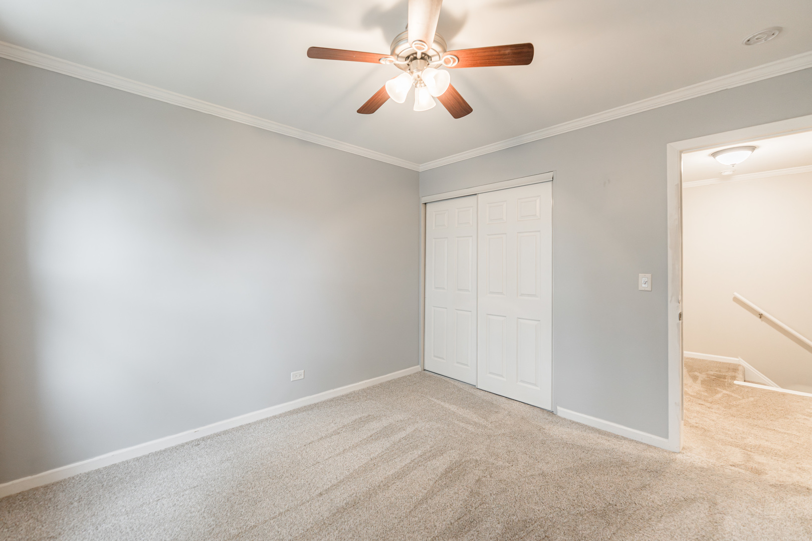 327 Georgetown Court, Unit B Bloomingdale, IL 60108 - Photo 15 of 25 an empty room with windows and fan